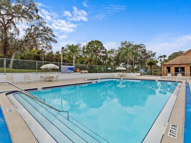 view of swimming pool featuring a patio area