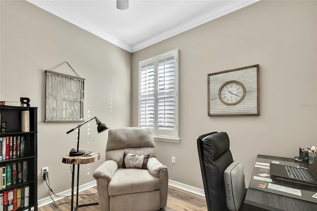 office space with light wood-type flooring and ornamental molding