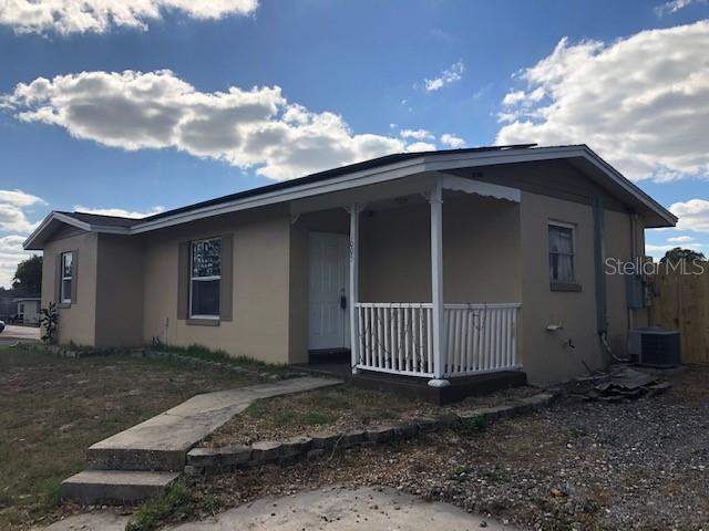 view of front of home featuring central AC unit and covered porch