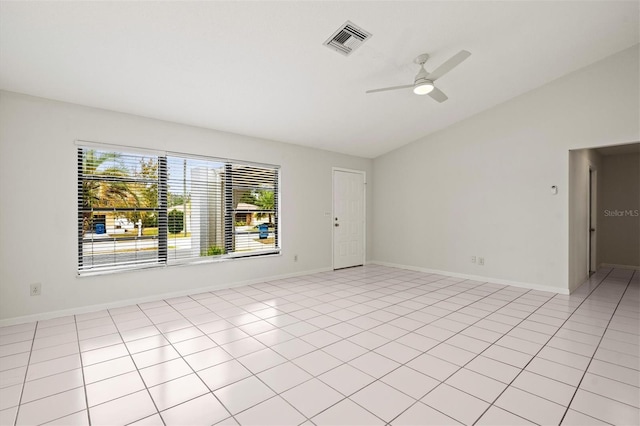 tiled spare room featuring lofted ceiling and ceiling fan