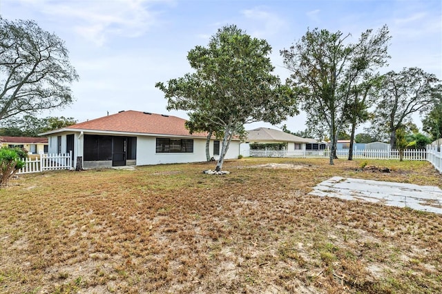 view of yard featuring a sunroom