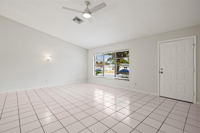 unfurnished room with ceiling fan and light tile patterned floors