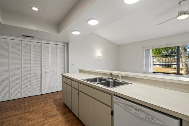 kitchen featuring ceiling fan, sink, dark wood-type flooring, and white dishwasher