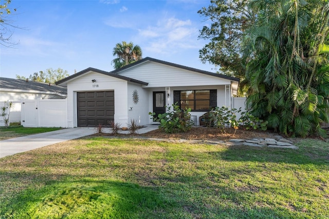 view of front facade with a garage and a front lawn