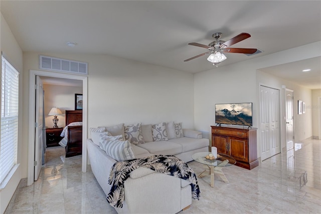 living room featuring ceiling fan