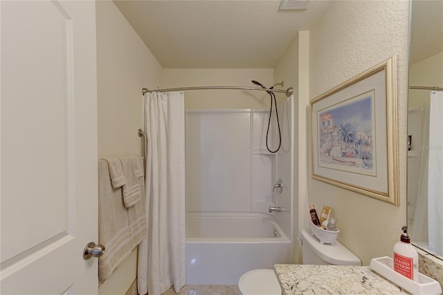 full bathroom with vanity, shower / bath combination with curtain, a textured ceiling, and toilet