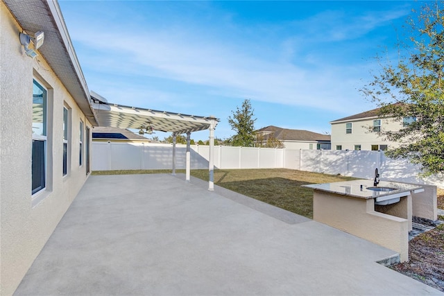 view of patio with a pergola and an outdoor bar