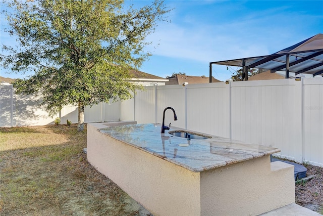 view of patio featuring an outdoor wet bar