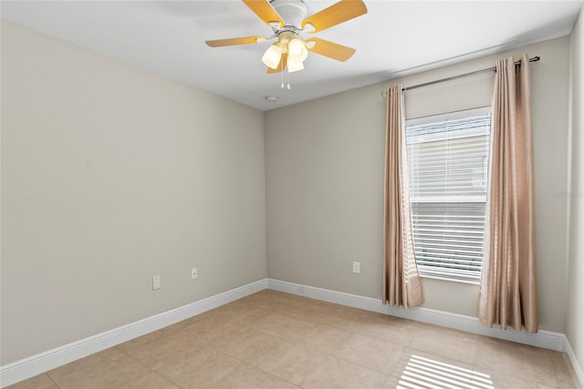 tiled empty room featuring ceiling fan