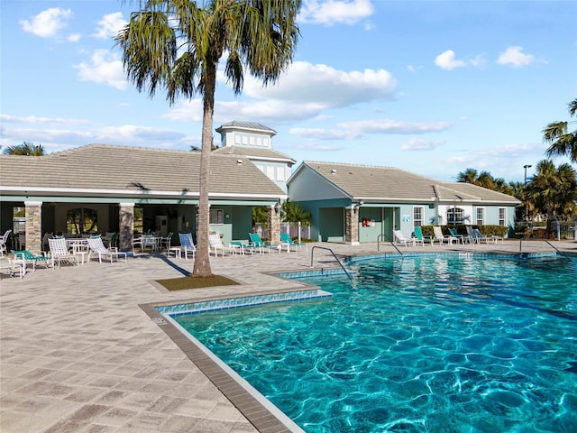 view of swimming pool featuring a patio area