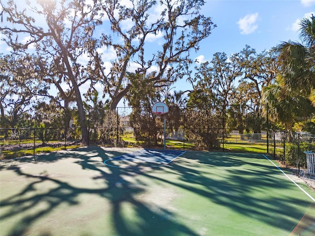 view of sport court featuring basketball hoop