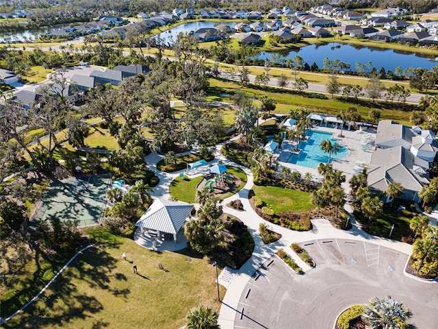 birds eye view of property with a water view