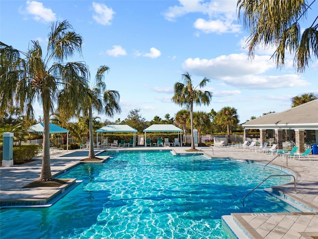 view of swimming pool featuring a patio and a gazebo