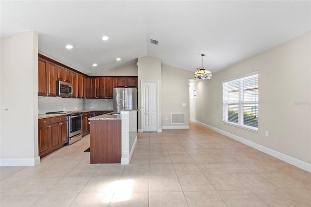 kitchen with backsplash, light stone countertops, a kitchen island with sink, lofted ceiling, and stainless steel appliances