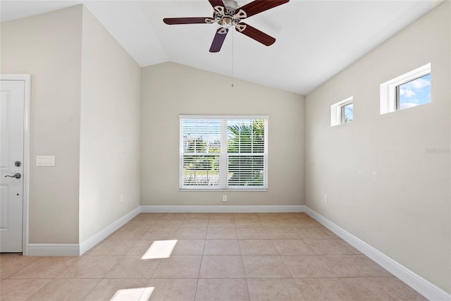 spare room featuring ceiling fan, light tile patterned floors, and lofted ceiling