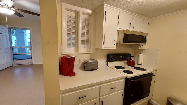 kitchen featuring tasteful backsplash, a textured ceiling, ceiling fan, white electric stove, and white cabinets