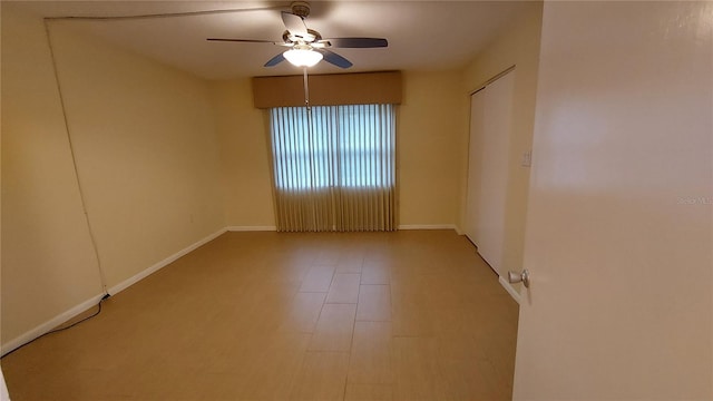 spare room with ceiling fan