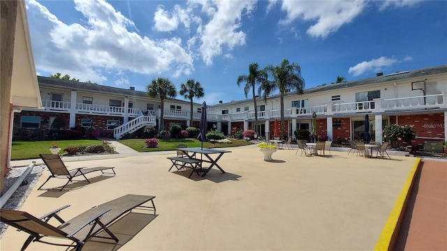 view of home's community with a patio