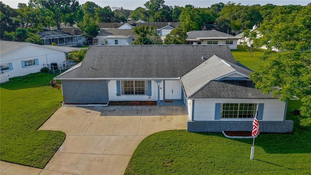 ranch-style home with a front yard