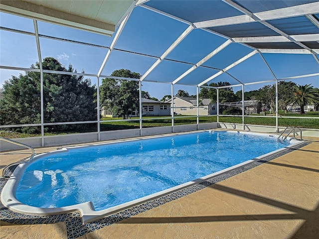 view of swimming pool with glass enclosure