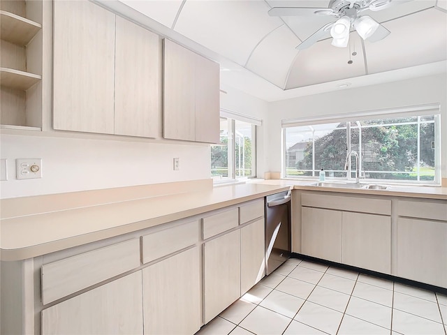 kitchen with ceiling fan, dishwasher, light tile patterned floors, and sink