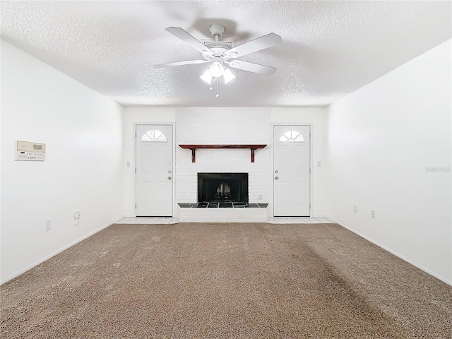 unfurnished living room featuring light carpet, ceiling fan, and a textured ceiling