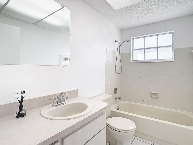 full bathroom featuring tile patterned floors, vanity, a textured ceiling, toilet, and tiled shower / bath