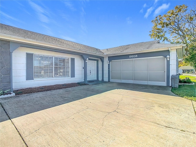 ranch-style home featuring a garage