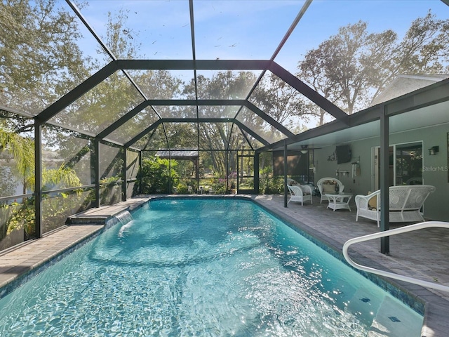 view of swimming pool with a patio area and glass enclosure