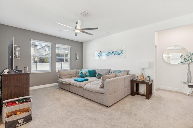 carpeted living room with ceiling fan
