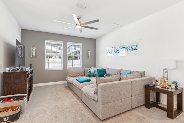 carpeted living room featuring ceiling fan
