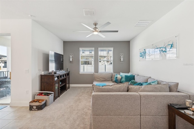living room with ceiling fan and light colored carpet