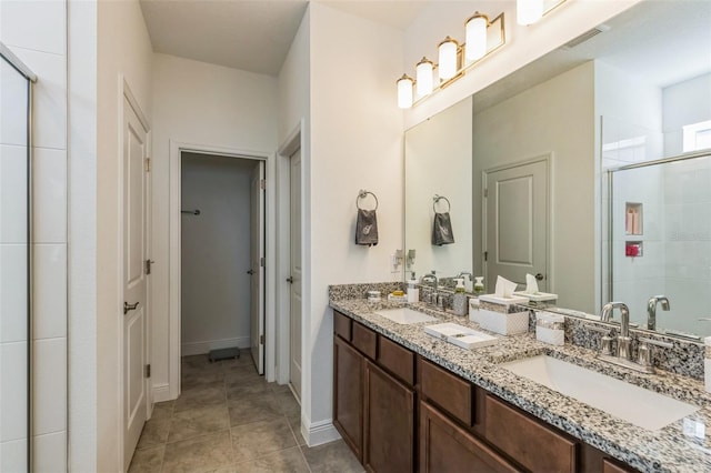 bathroom with vanity, tile patterned floors, and walk in shower
