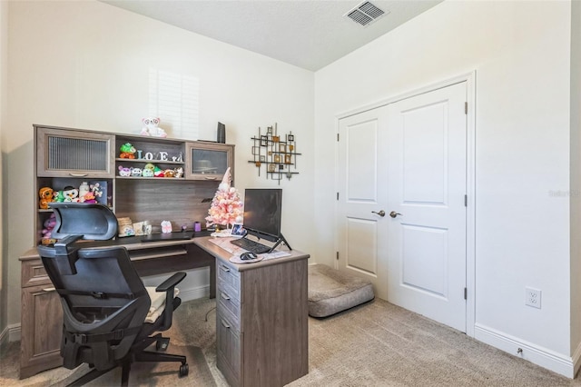 office area with light colored carpet
