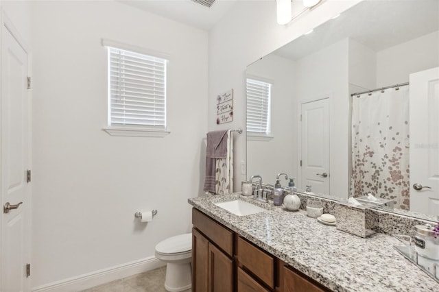 bathroom featuring a shower with curtain, tile patterned flooring, vanity, and toilet