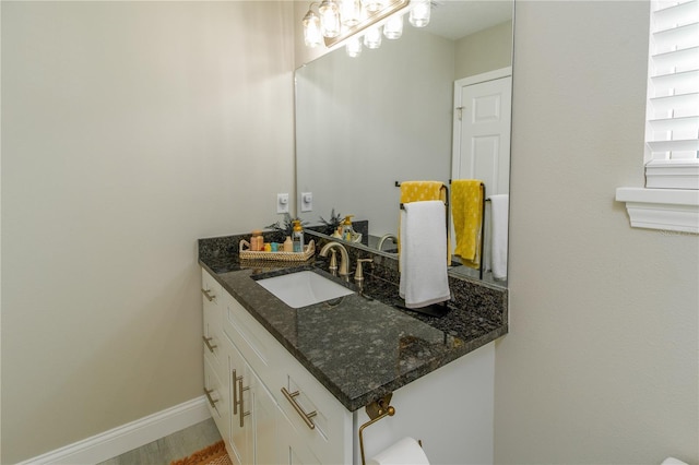 bathroom with wood-type flooring and vanity