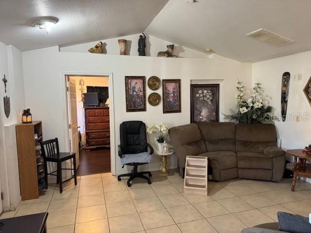 tiled living room with lofted ceiling