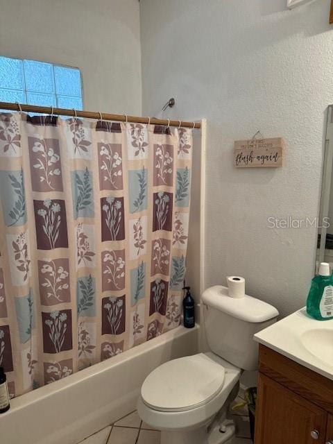 full bathroom with tile patterned floors, vanity, toilet, and shower / tub combo with curtain