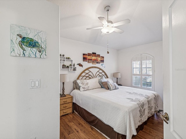 bedroom featuring ceiling fan and dark hardwood / wood-style flooring