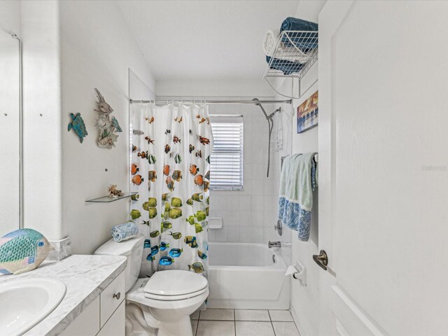 full bathroom featuring tile patterned flooring, vanity, toilet, and shower / bathtub combination with curtain