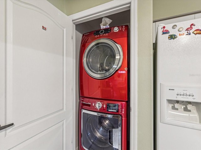 washroom featuring stacked washing maching and dryer