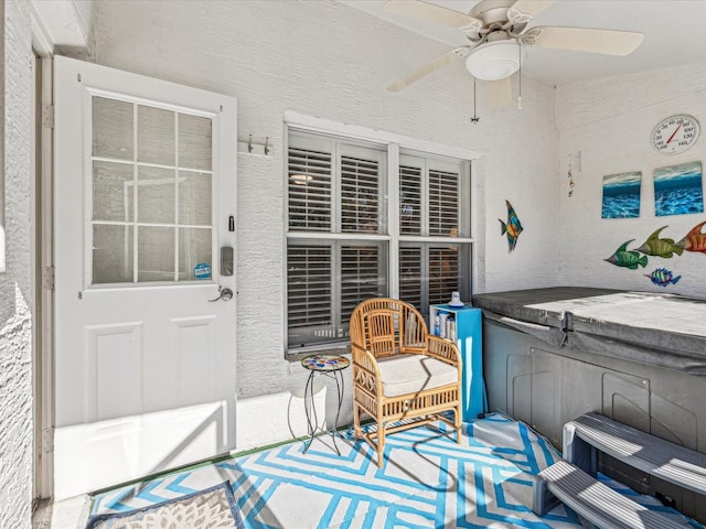 view of patio featuring a hot tub and ceiling fan