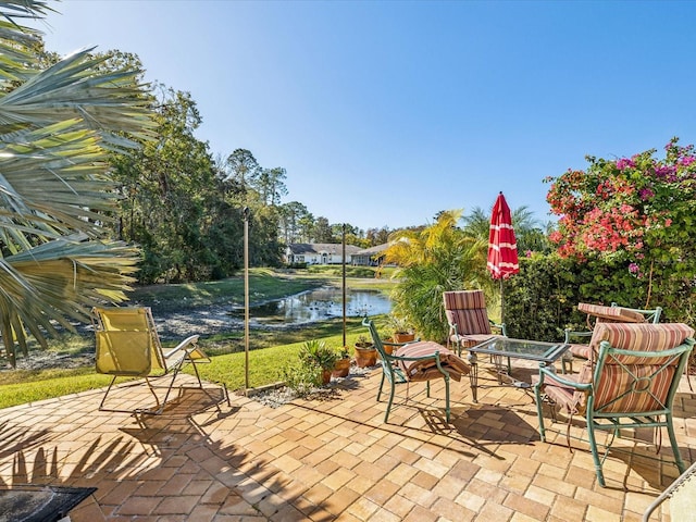 view of patio / terrace featuring a water view