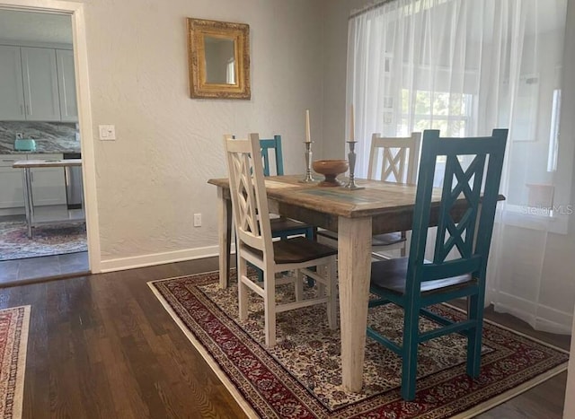 dining room with dark wood-type flooring