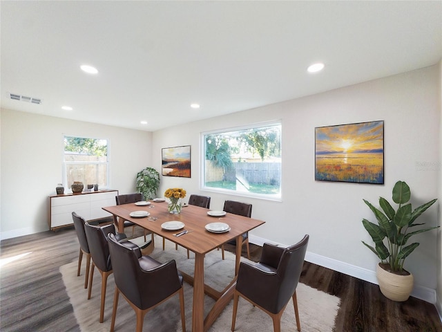 dining area with dark hardwood / wood-style floors