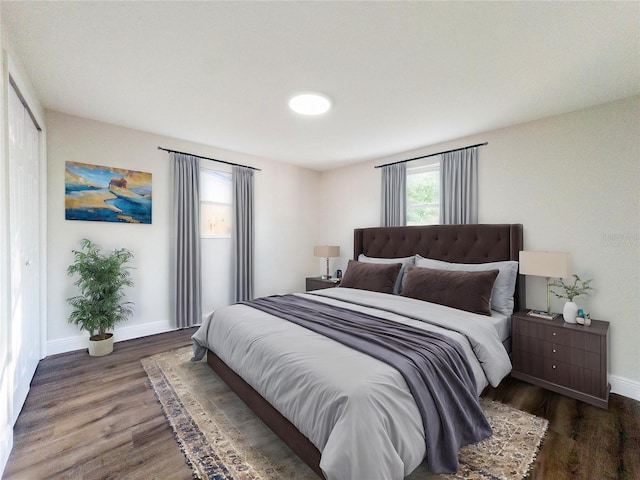 bedroom with dark hardwood / wood-style floors