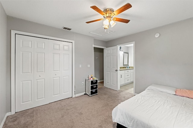 carpeted bedroom with ceiling fan, a closet, and connected bathroom