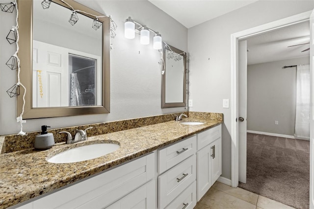 bathroom featuring vanity, tile patterned floors, and ceiling fan