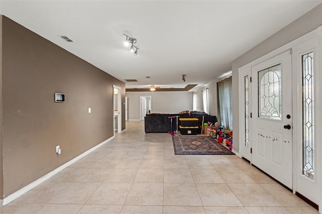 foyer entrance featuring light tile patterned floors