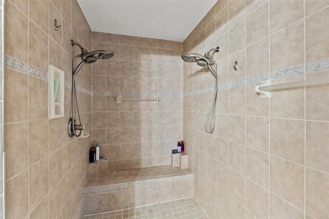 bathroom with tiled shower